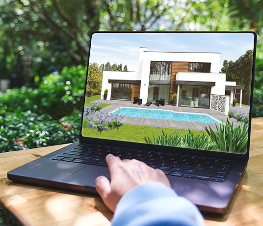 Personne regarde villa moderne sur ordinateur portable.